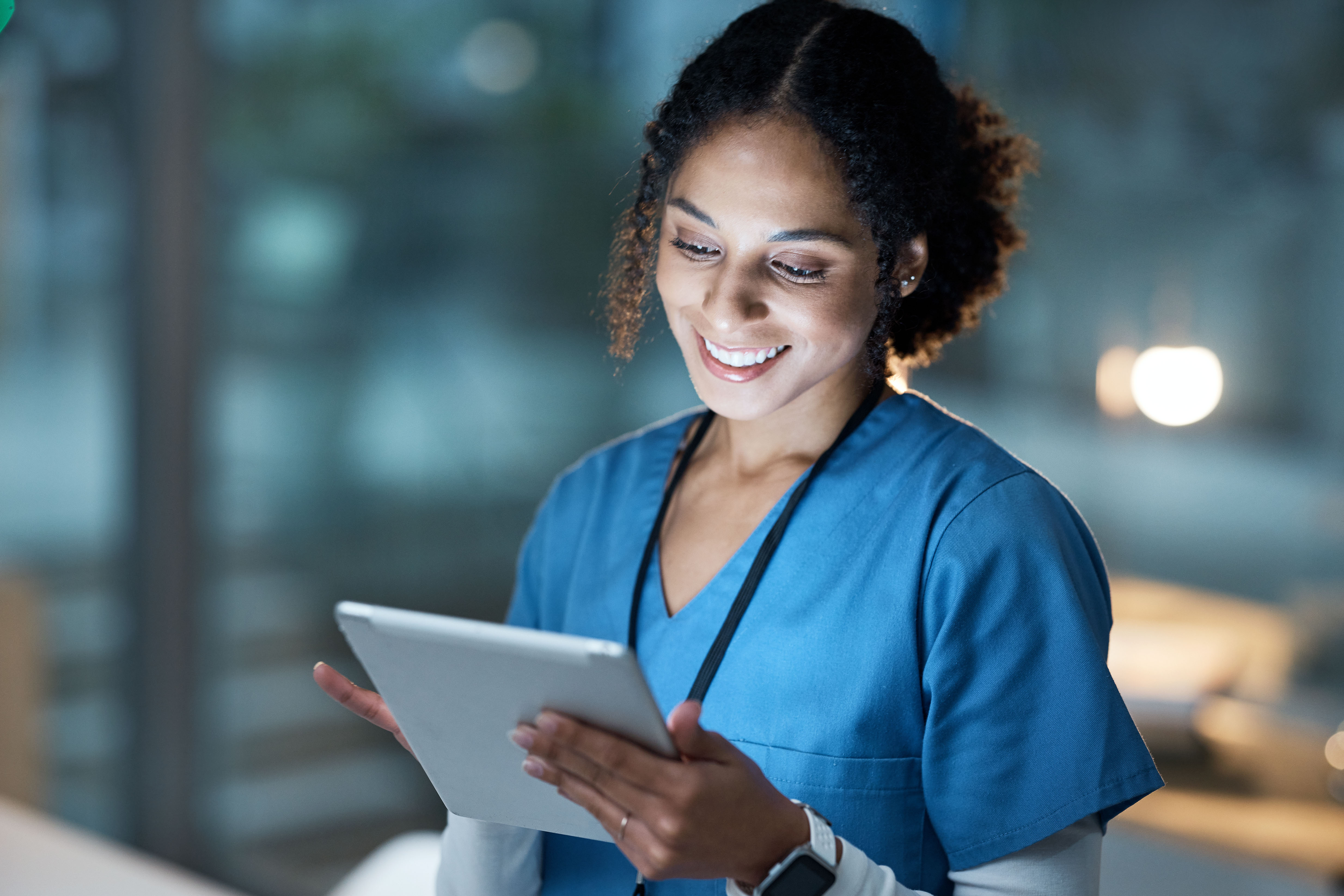 Healthcare professional using tablet for telehealth consultation